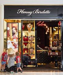 Honey Birdette Releases Ad Showing Model Straddling Santa