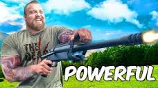 World's Strongest Man VS WORLD'S BIGGEST GUN!!! - YouTube