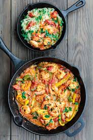 easy shrimp cooked in skillet with shallots bell peppers and a white wine olive