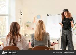 young woman teaching students makeup