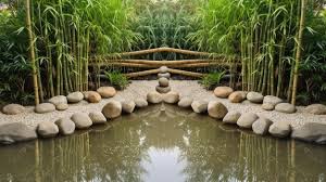 A Zen Garden With A Bamboo Fence And A