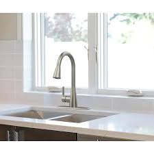 Installing a new bathroom faucet and side sprayer is a project many homeowners who are handy with a few common tools can do themselves. Project Source Stainless Steel 1 Handle Deck Mount Pull Down Handle Kitchen Faucet Deck Plate Included Lowes Com Kitchen Faucet Faucet Kitchen Handles