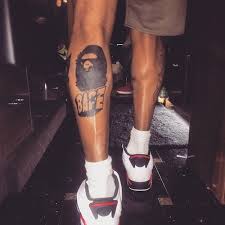 Pin up girls tattoo meaning and designs. Chris Brown S New Bape Astro Boy And Dragonball Z Leg Tattoos Tattoodo