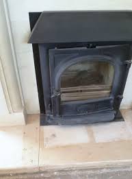 flood stained limestone fireplace