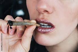 female lips smoking self roll weed