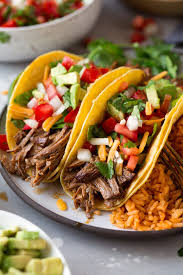 Cook and stir beef, sausage, and onion in the hot skillet until meat is browned and crumbly, 5 to 7 minutes. Slow Cooker Shredded Beef Tacos Cooking Classy