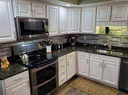 Once the cabinet is free from the wall, you and a partner can lift it down from the support blocks. Get New Kitchen Cabinets Revelare Kitchens