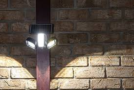 install solar lights on a brick wall