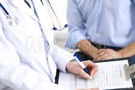 Female Doctor Holding Application Form While Consulting Man Patient