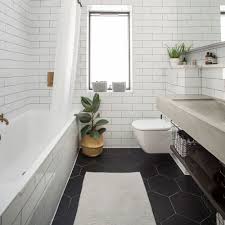 Floors and walls are draped in the same color tile, yet different sizes and maybe different shapes are used on the walls to break up the consistency and to create interest and intrigue. Bathroom Tile Ideas Wall And Floor Solutions For Baths Showers And Sinks Using Metro Tiles Mosaics And More