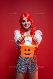 clown makeup and bright wig showing