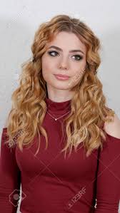 This list features 11 of our greatest finds for blonde hair that really brings out that shimmering hue. Girl Is Blonde With Curly Hair In A Dark Cherry Turtleneck Stock Photo Picture And Royalty Free Image Image 140758314