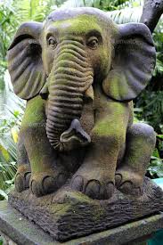 Stone Elephant Statue Covered With Moss