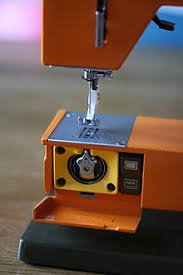 On a sewing machine, the area under the needle holds the parts that are known as the shuttle, bobbin and feed dog. Sewing Machine Wikipedia