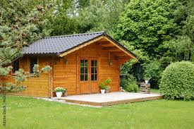 Wooden Hut In Spring Garden Shed For