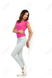 Casual Young Woman In Pink Shirt Light Blue Jeans And White