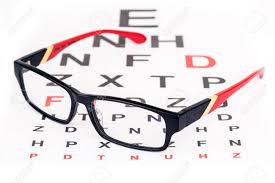 Stylish Red Framed Specs Over English Eye Test Chart