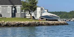 boat crashes into house at lake of the