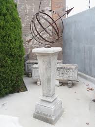 carved tapered limestone armillary
