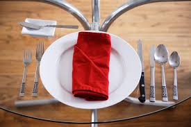 napkins and utensils on a table