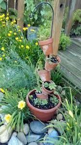 Shepherds Hook And Terra Cotta Pots