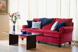 red sofa with blue accent throw pillows
