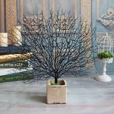 Kirkland's selection of artificial trees and topiaries is designed to stay lively and green throughout all seasons! Artificial Tree Branch Peacock Coral Photography Props Christmas Home Decor Floral Decor