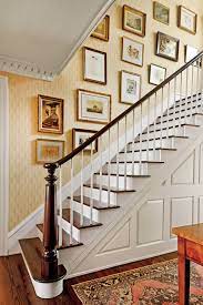 To me, it is just clutter there. How To Hang Art In A Stairwell Southern Living