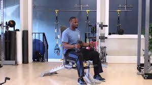 arm exercise with dumbells sitting down