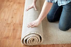 how to quickly flatten a new area rug