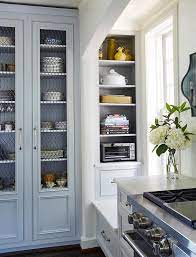 gray china cabinet with glasetal