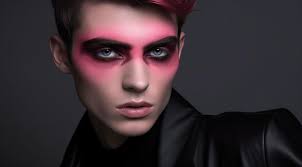 a man with pink eyes and pink makeup