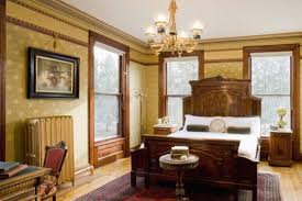 Design ideas for a victorian master bedroom in london with grey walls, light hardwood flooring, a wood burning stove and a … modern house interior design. How To Create Modern Victorian Interiors