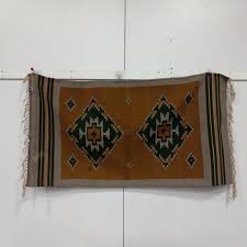 the handwoven rug by indians