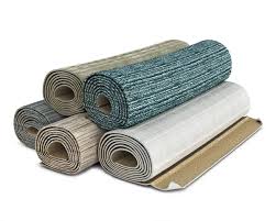 various carpet rolls stacked one