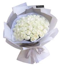 50 white roses in a hand bouquet