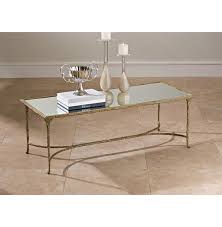 Iron, corian, and tempered glass. Delano Hollywood Regency Antique Gold Sculpted Leaf Mirrored Rectangular Coffee Table 51 W 60 W Kathy Kuo Home