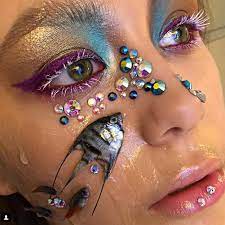 makeup artist uses dead tropical fish