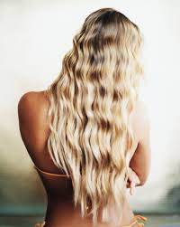 Her hair is blonde and extremely long, and it's usually styled in a huge ponytail and two big, black bows on each side of her hair. Can Your Hair Color Lighten From Brown To Blonde Naturally On Its Own Allure