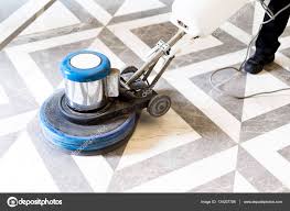 man polishing marble floor in office