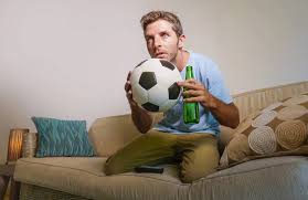 holding beer bottle and soccer ball