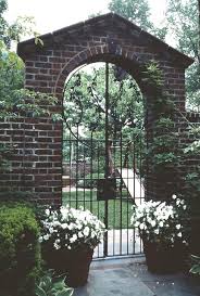 Brick Arched Garden Entry With Wrought