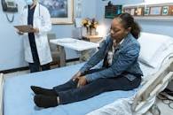 Woman in Blue Scrub Suit Helping Woman Sitting on Bed · Free ...