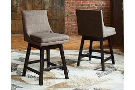 Bar stools, especially outdoor backless bar stools, are multipurpose and can be used indoors as extra chairs at tables or for guests. Tallenger Counter Height Bar Stool Ashley Furniture Homestore