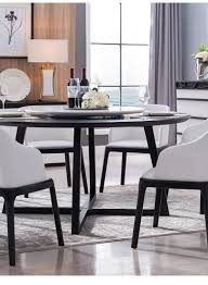 It's made from solid wood, with a circular surface set on four flared, tapered legs. China Fashion Modern Mdf Veneer Round Dining Table 8 Seater Lazy Susan Selectable China Wooden Dining Table Dining Room Table