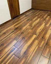 brown polished wooden floor tiles
