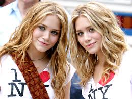 She used to color her hair blond, now she keeps her natural color in the back and has blond and brown. Mary Kate And Ashley Olsen S Hair Evolution People Com