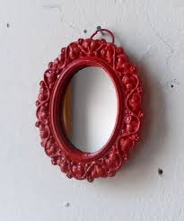 miniature wall mirror in ruby red