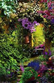 Pots of all sizes and shapes decorate the steps and nestle among the borders. Creating A Secret Garden Decor To Adore