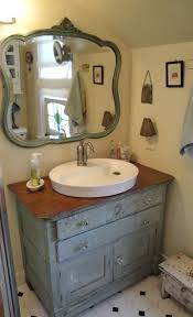 After buying the piece for about $650 plus shipping, she cleaned and sanded it, then added four coats of polyurethane to protect it from water, while trying to retain the character of the piece. Bathroom Remodel Reveal Shabby Chic Bathroom Shabby Chic Dresser Diy Bathroom Vanity